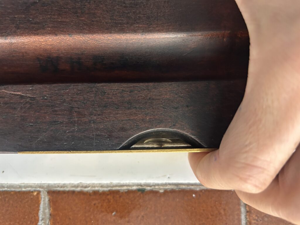 Inscription on antique spirit level: WHP for Wilfred Harold Pickin